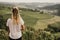 Famous heart shaped road at vineyards Å piÄnik in Slovenia. Woman standing at the edge and looking at wonderful grape